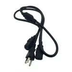 A black C13 power lead with a US three-prong wall plug, coiled on a white background.