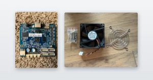 A Bitmain Antminer control board out of its chassis and a replacement miner fan with its finger guard and screws.