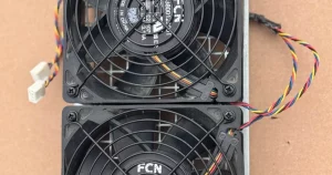 An Antminer S19/S21 dual fan assembly on its backplate.