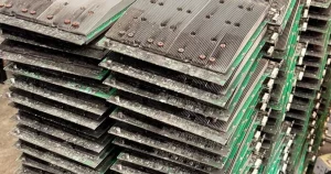 A stack of Antminer hashboards pulled out for service.