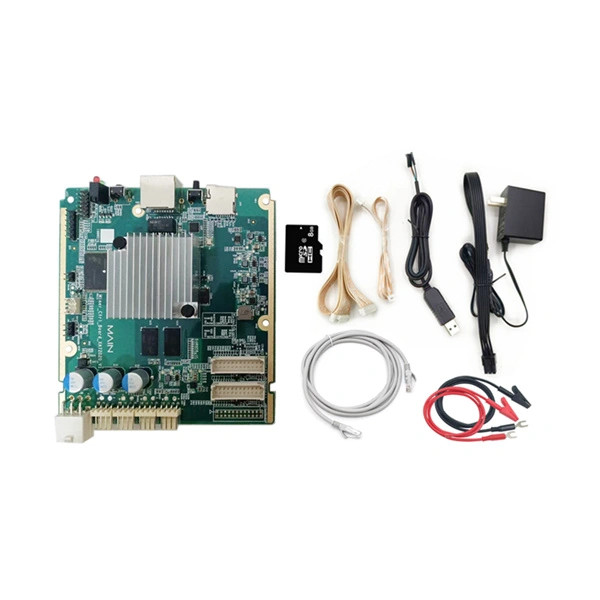 An Antminer E9 hashboard test fixture laid out with its accessories: a green control board with heatsink, a microSD card, a network cable, a power adapter and a pair of red and black test leads.