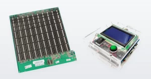 An Antminer S19 Pro hashboard and a universal Antminer hashboard test fixture.