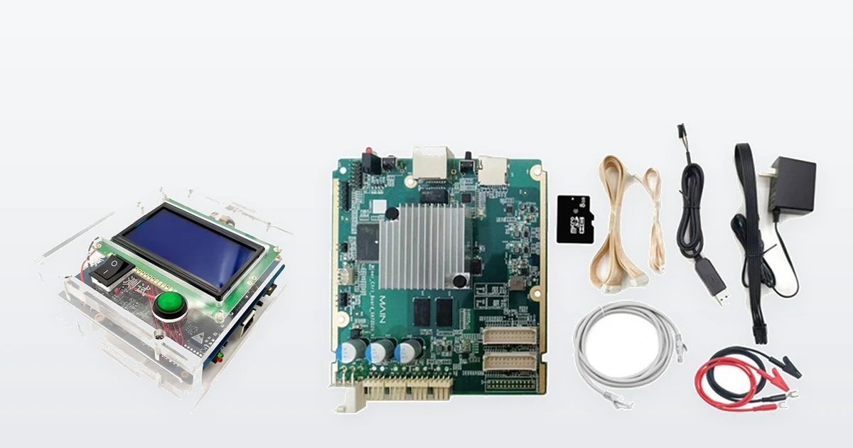 A universal Antminer hashboard test fixture in its clear acrylic case, with a blue LCD and a green start button, beside a Bitmain Antminer E9 hashboard test fixture main board and its accessory kit of leads, SD card, mains adapter and crocodile clips.