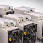 Antminer S19k Pro units in two rows, dual cooling fans and control boards facing out.